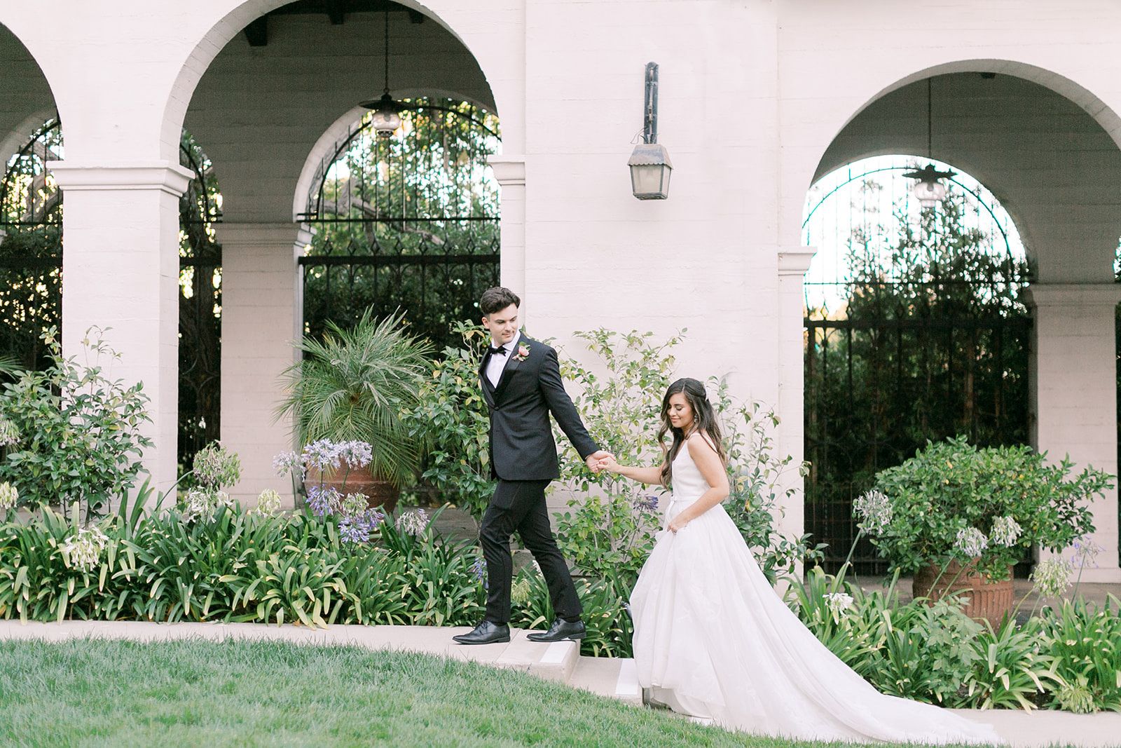 Bride and groom holding hands