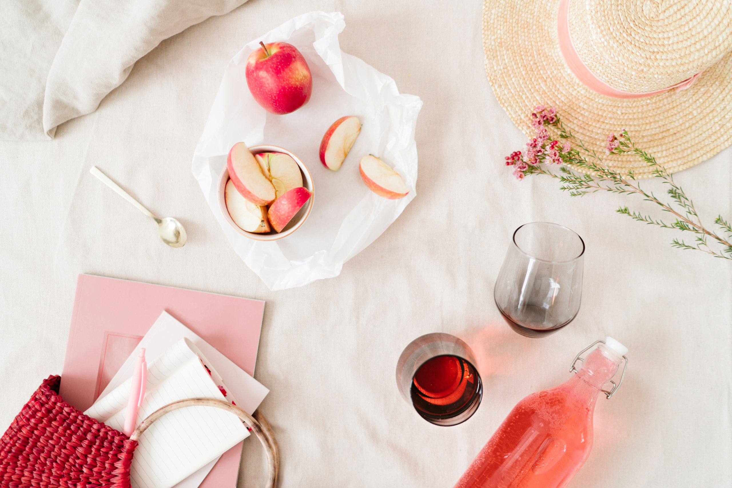 Food spread. Apples, wine, flowers.